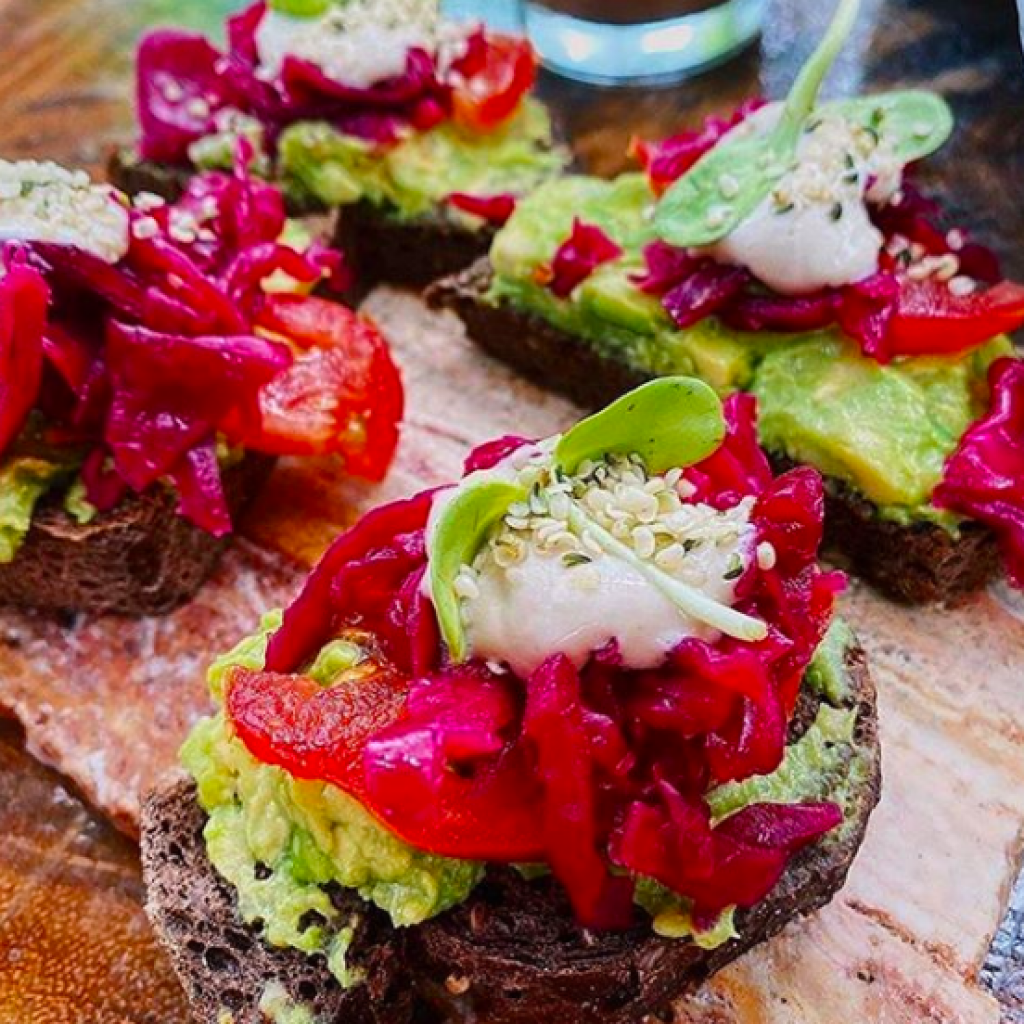 avocado toast with saurkraut from the vegan menu at Raw Love Tulum restaurant 