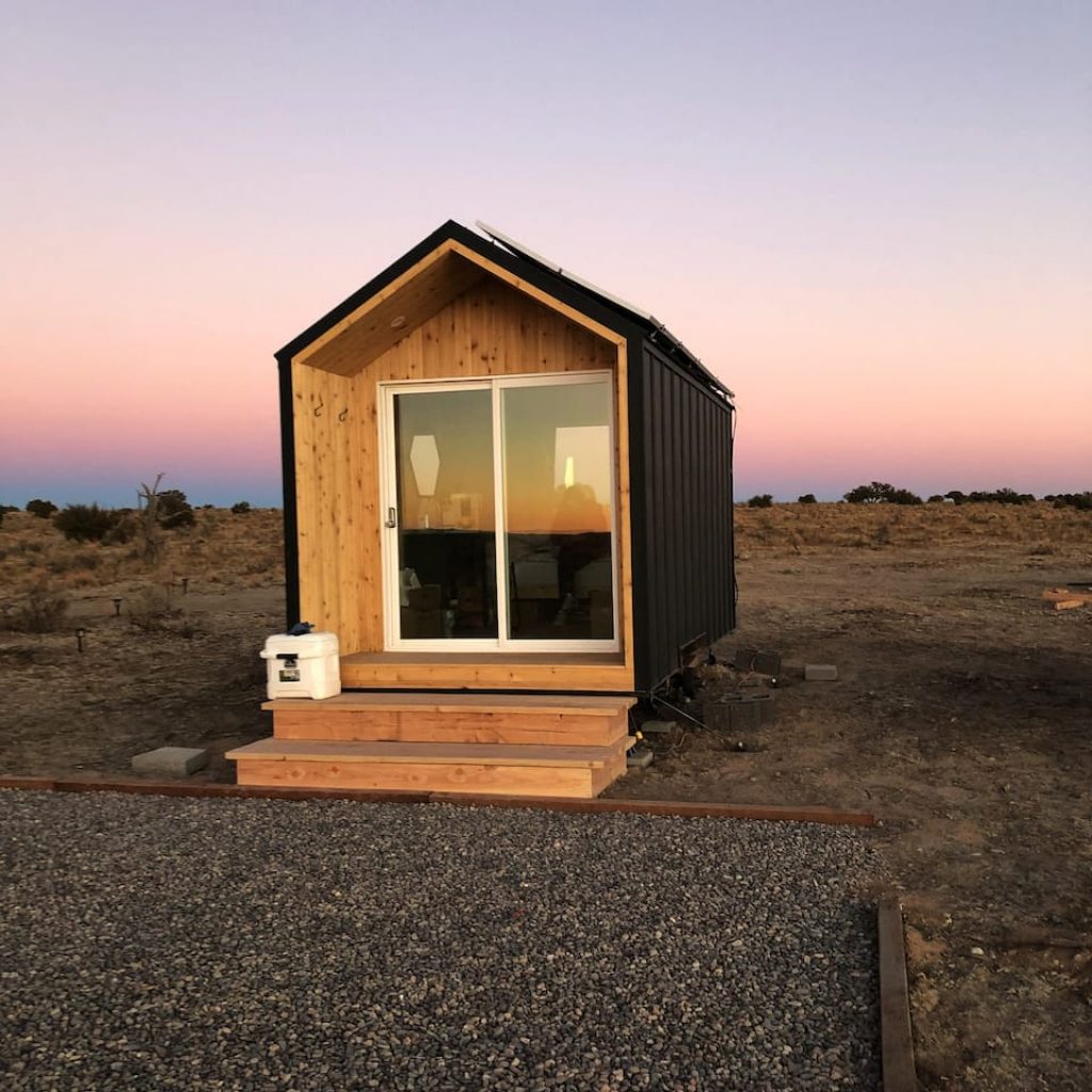 Telescope tiny house in nature at sunset for vacation rental