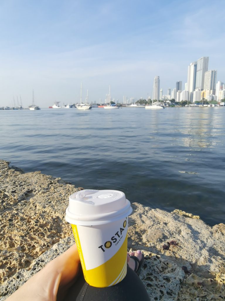 A takeaway coffee at the marina boardwalk in Cartagena Colombia at the waterline